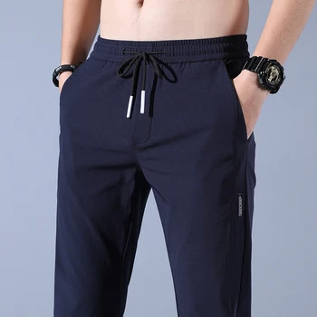 2023 Нови мъжки ежедневни панталони пролет лято плътен цвят мода джоб апликация пълна дължина случайни работни панталони направо Pantalon